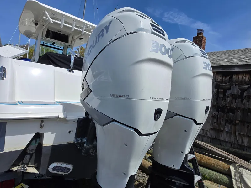 Slide: The Image of Twin Mercury Verado engines on a 2013 Boston Whaler 280 Outrage boat. - 27