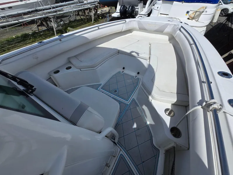 Slide: The Image of 2013 Boston Whaler 280 Outrage boat interior with spacious seating and sleek design. - 5
