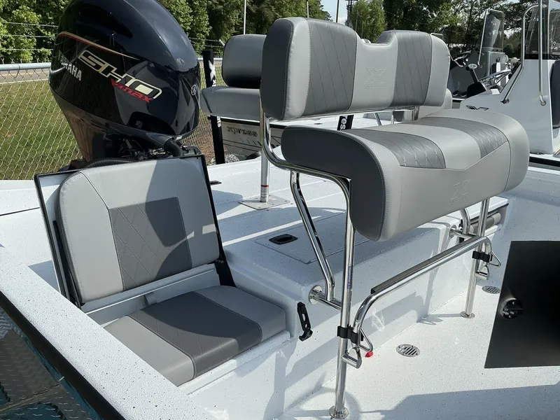Slide: The Image of 2025 Xpress Hyper-Lift Series H22B boat interior with Yamaha engine and seating. - 10