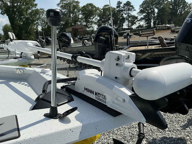 Slide: The Image of 2025 Xpress Hyper-Lift H22B boat with Minn Kota Terrova trolling motor, parked outdoors. - 3