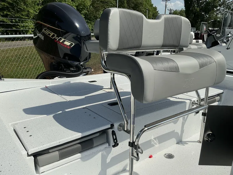 Slide: The Image of 2025 Xpress Hyper-Lift Series H22B boat with Yamaha engine and cushioned seating. - 8