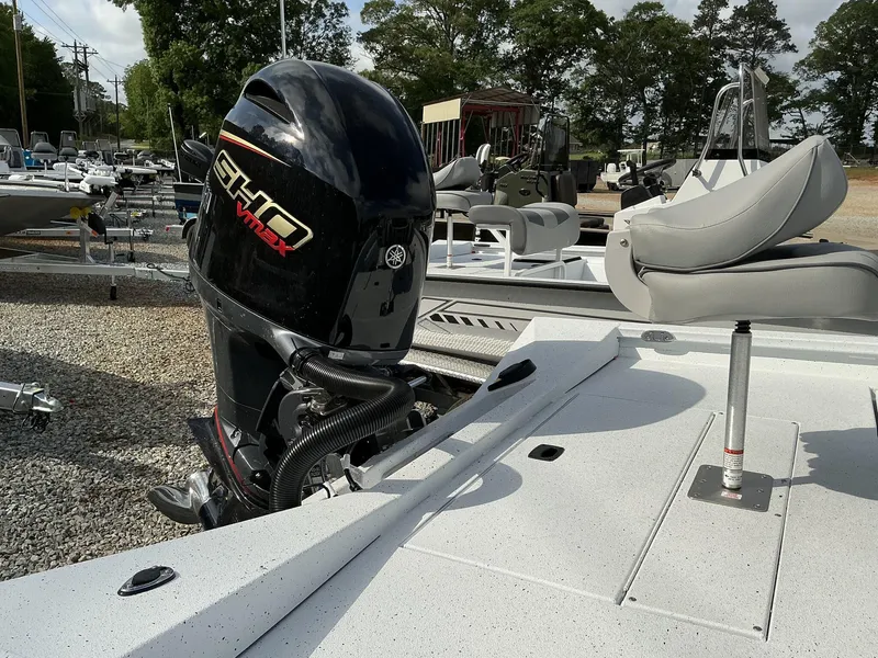 Slide: The Image of 2025 Xpress Hyper-Lift Series H22B boat with Yamaha SHO VMAX engine, parked outdoors. - 11