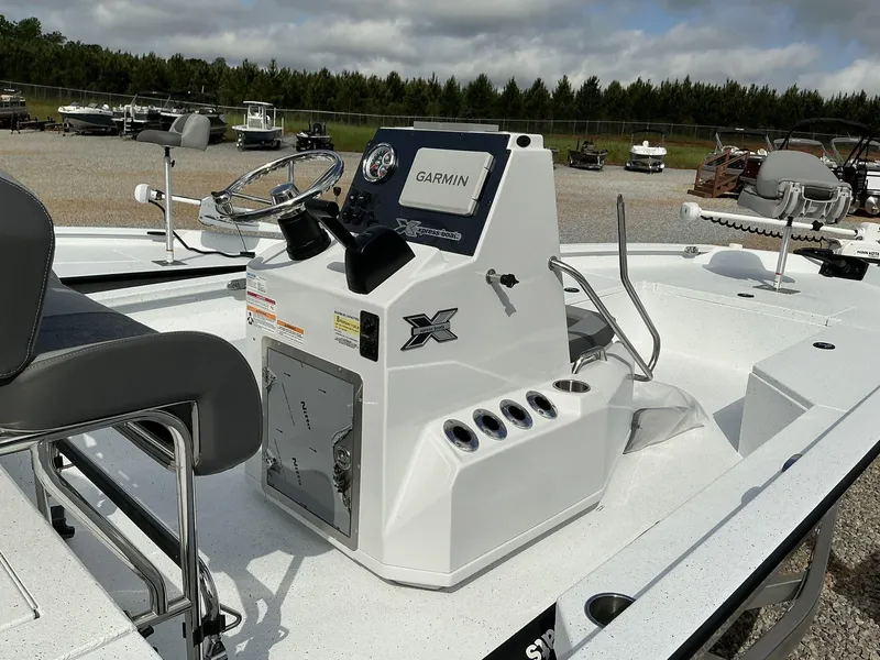 Slide: The Image of 2025 Xpress Hyper-Lift Series H22B boat with Garmin navigation system, sleek white design. - 14