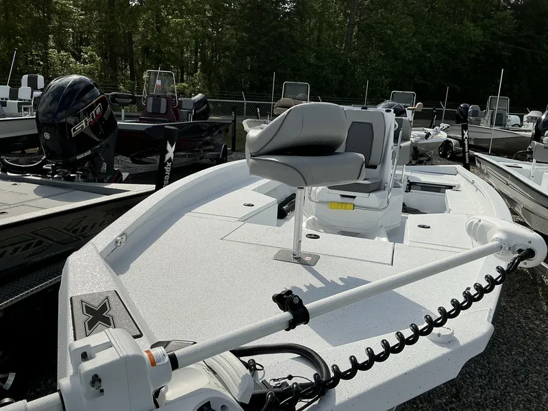 Slide: The Image of 2025 Xpress Hyper-Lift Series H22B boat with seating and motor, displayed outdoors. - 4
