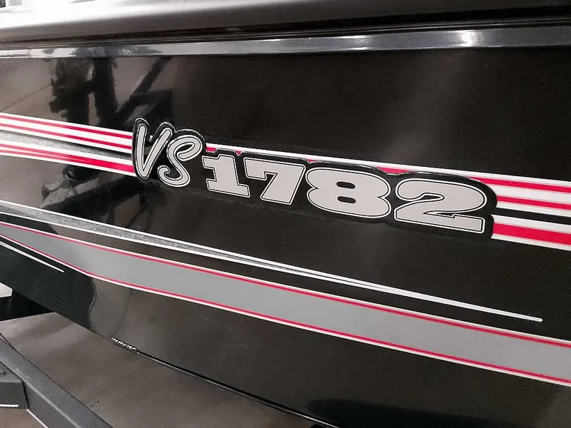 Slide: The Image of 2025 Ranger VS1782SC Angler boat with sleek black and red design. - 1
