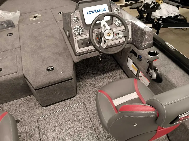Slide: The Image of 2025 Ranger VS1782SC Angler boat interior with steering wheel and Lowrance display. - 18