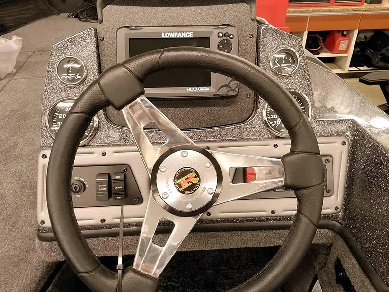 Slide: The Image of Steering wheel and dashboard of 2025 Ranger VS1782SC Angler boat with Lowrance display. - 21