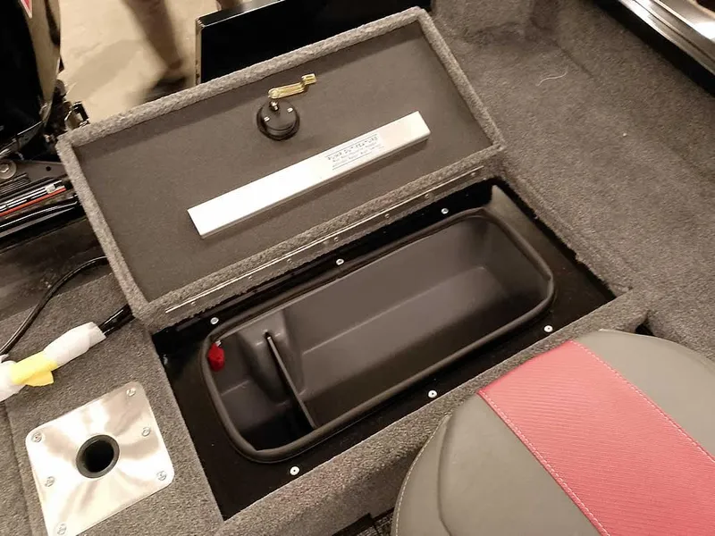 Slide: The Image of 2025 Ranger VS1782SC Angler boat storage compartment with open lid and seating detail. - 25