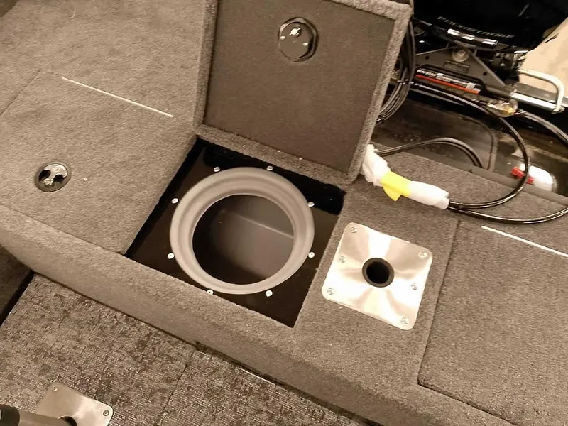 Slide: The Image of 2025 Ranger VS1782SC Angler boat interior with storage compartment and fishing rod holder. - 26