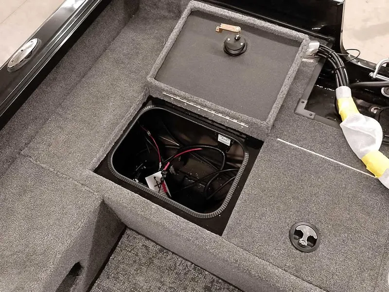 Slide: The Image of 2025 Ranger VS1782SC Angler boat storage compartment with wiring visible. - 27