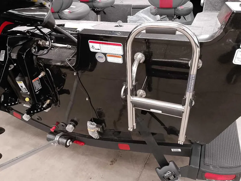 Slide: The Image of 2025 Ranger VS1782SC Angler boat with ladder and motor, interior seating visible. - 32