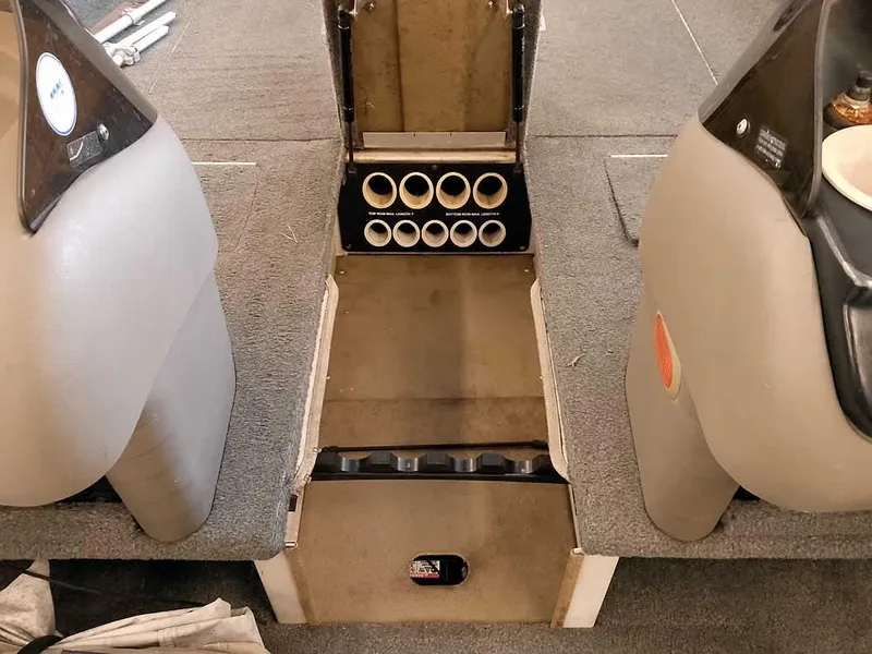 Slide: The Image of 2006 Crestliner 1850 Fish Hawk DC interior with rod storage compartment. - 15