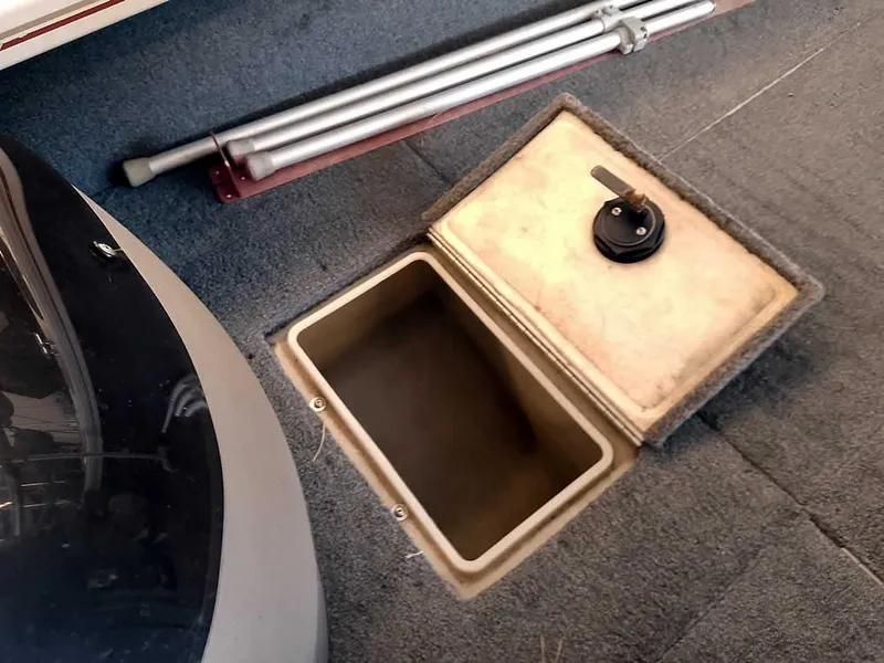 Slide: The Image of Open storage compartment on 2006 Crestliner 1850 Fish Hawk DC boat deck. - 18
