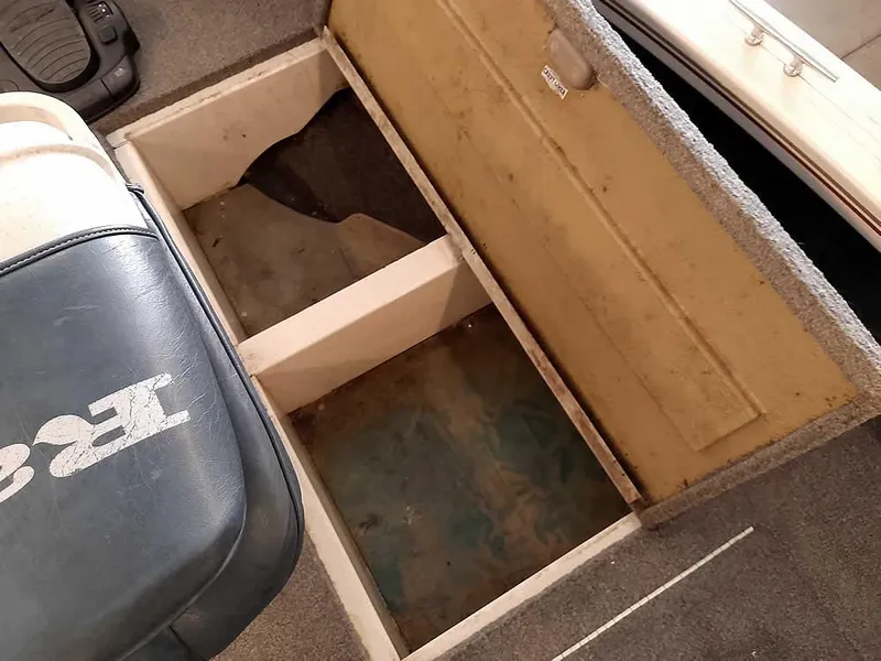 Slide: The Image of Open storage compartment in 2006 Crestliner 1850 Fish Hawk DC boat interior. - 19