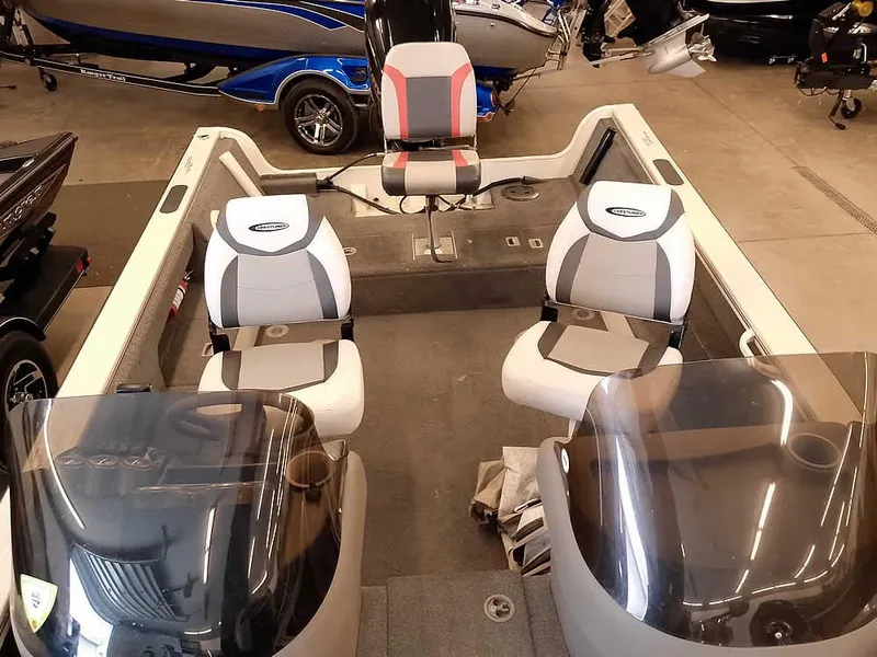 Slide: The Image of 2006 Crestliner 1850 Fish Hawk DC boat interior with three seats and dual consoles. - 23