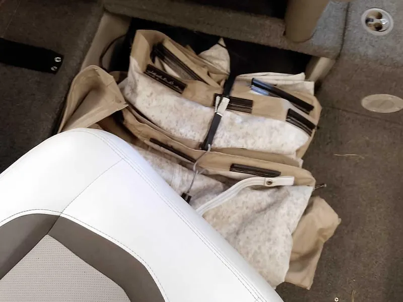 Slide: The Image of Crestliner 1850 Fish Hawk DC 2006 boat interior with life jackets and seating. - 24