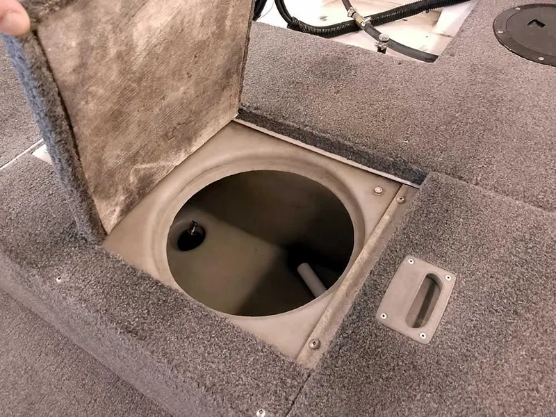 Slide: The Image of 2006 Crestliner 1850 Fish Hawk DC livewell compartment with open lid, showcasing interior details. - 31