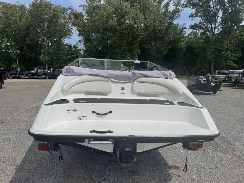 Slide: The Image of 2013 Yamaha SX190 boat rear view in outdoor setting. - 3