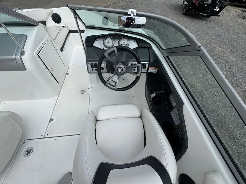Slide: The Image of 2013 Yamaha Boats SX190 cockpit with steering wheel and dashboard controls. - 5