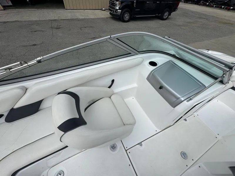 Slide: The Image of 2013 Yamaha Boats SX190 interior with white seating and windshield. - 6