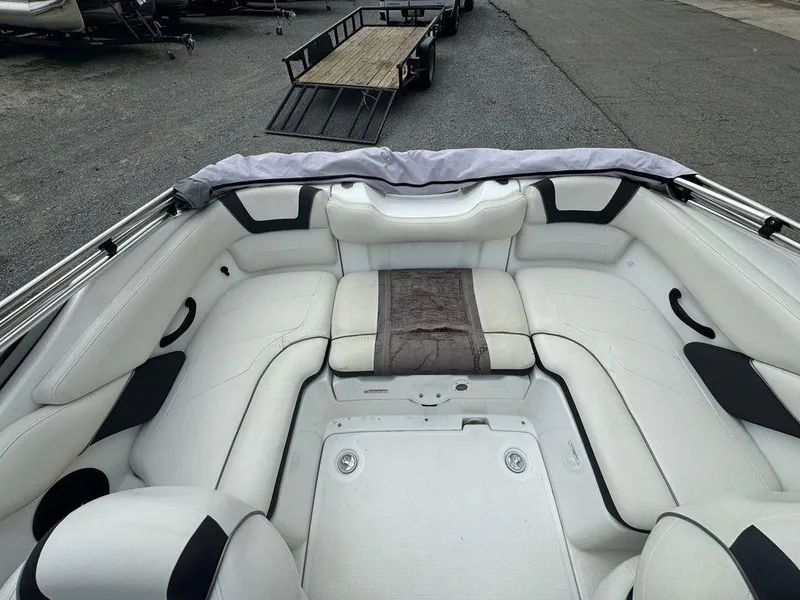Slide: The Image of 2013 Yamaha Boats SX190 interior with white seating and a central cushion. - 7