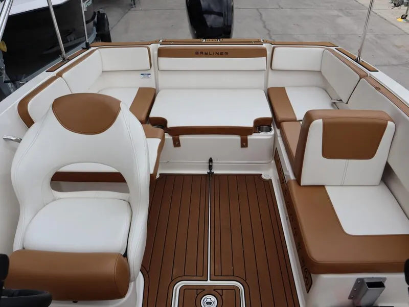 Slide: The Image of 2022 Bayliner VR4 Bowrider Outboard interior with brown and white seating. - 15
