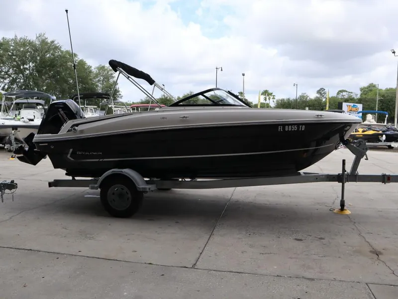 Slide: The Image of 2022 Bayliner VR4 Bowrider Outboard on trailer, parked outdoors. - 3