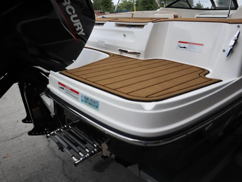 Slide: The Image of 2022 Bayliner VR4 Bowrider Outboard with Mercury engine, featuring teak-style swim platform. - 4