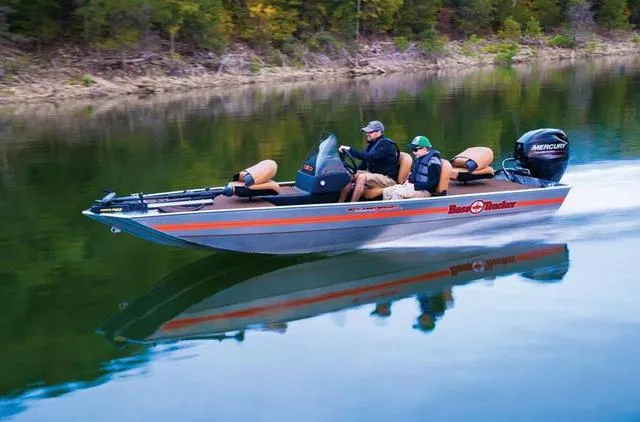 Slide: The Image of 2018 Tracker BASS TRACKER® 40th Anniversary Heritage Edition boat speeding on a calm lake. - 15