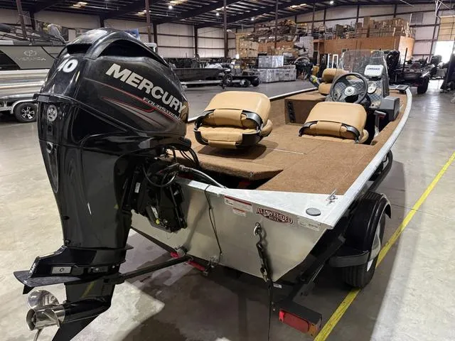 Slide: The Image of 2018 Tracker BASS TRACKER® 40th Anniversary Heritage Edition boat with Mercury engine in warehouse. - 4