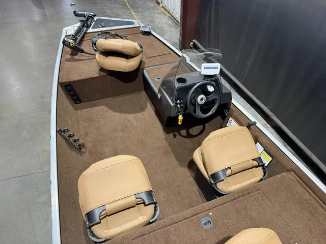 Slide: The Image of 2018 Tracker BASS TRACKER® 40th Anniversary Heritage Edition boat interior with tan seats and steering console. - 6