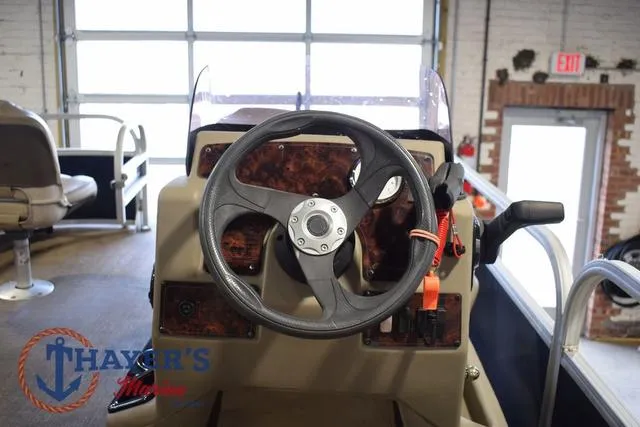 Slide: The Image of 2020 Sun Tracker Bass Buggy® 16 XL steering console in showroom setting. - 12