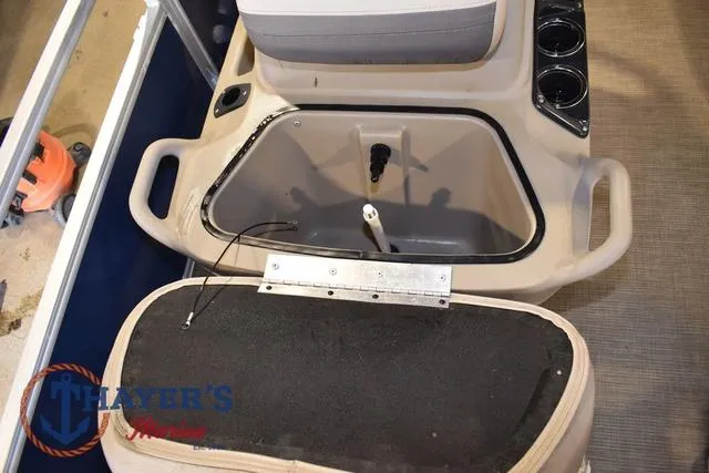 Slide: The Image of 2020 Sun Tracker Bass Buggy® 16 XL boat interior with storage compartment open. - 21