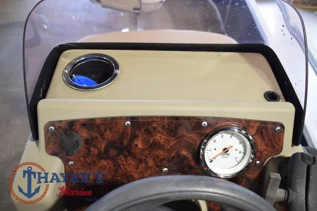 Slide: The Image of Dashboard of 2020 Sun Tracker Bass Buggy® 16 XL with speedometer and cup holder. - 29