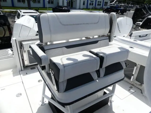 Slide: The Image of 2021 Blackfin 252CC boat seating with cushioned armrests and modern design. - 12
