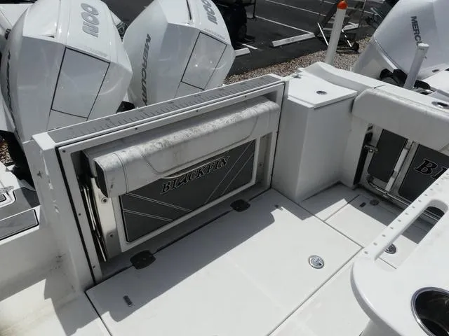 Slide: The Image of 2021 Blackfin 252CC boat deck with seating and Mercury outboard engines. - 13