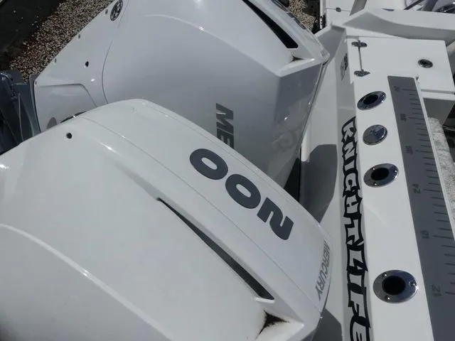 Slide: The Image of Close-up of 2021 Blackfin 252CC boat engines and deck details. - 18