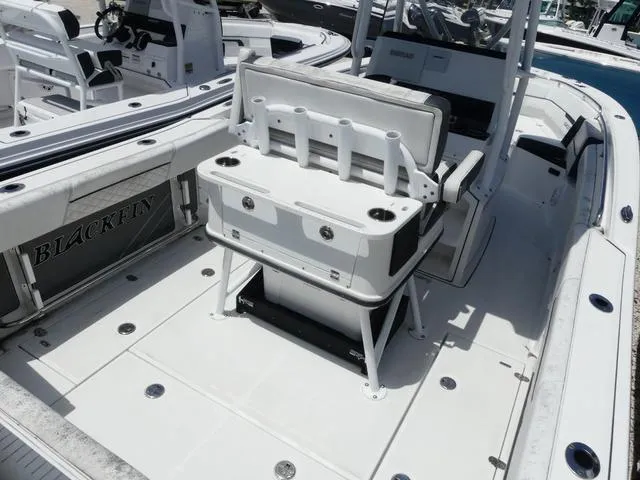 Slide: The Image of 2021 Blackfin 252CC boat interior with seating and rod holders. - 6