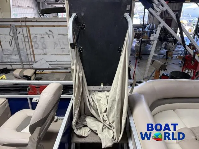 Slide: The Image of 2014 Sun Tracker 24' Fishin Barge Pontoon interior with seating and storage area. - 21