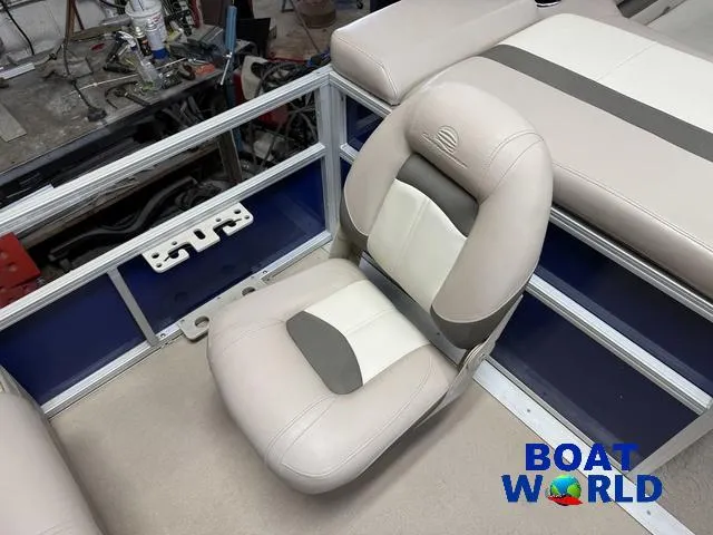 Slide: The Image of 2014 Sun Tracker 24' Fishin Barge Pontoon seat, beige and gray upholstery, Boat World logo. - 22