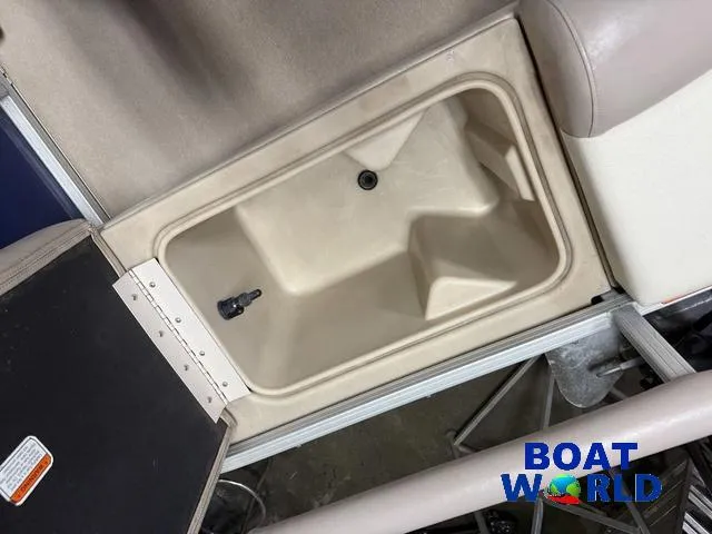 Slide: The Image of 2014 Sun Tracker Fishin Barge Pontoon storage compartment, open view, beige interior. - 24