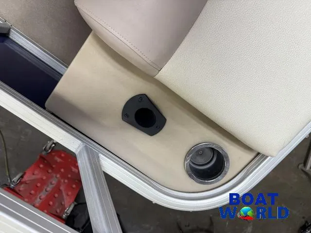 Slide: The Image of 2014 Sun Tracker Fishin Barge Pontoon interior with cup holder and seat detail. - 26