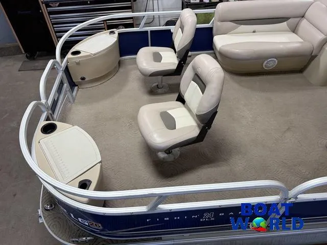 Slide: The Image of 2014 Sun Tracker 24' Fishin Barge Pontoon interior with seating and storage compartments. - 3