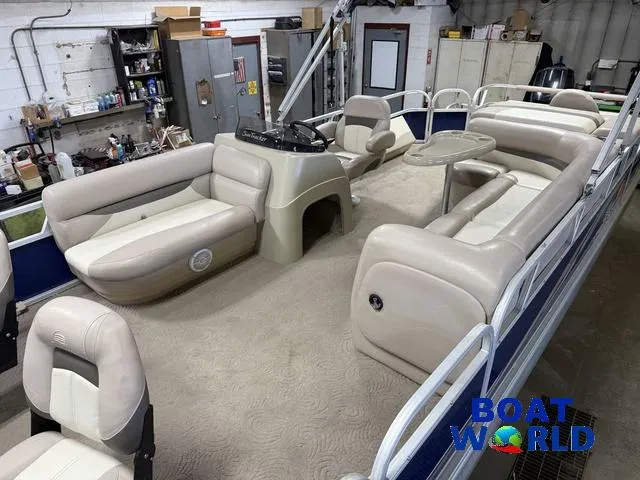 Slide: The Image of 2014 Sun Tracker 24' Fishin Barge Pontoon with Mercury 150HP, spacious seating, and beige interior. - 4