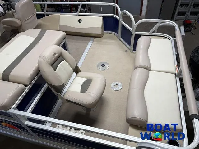Slide: The Image of 2014 Sun Tracker 24' Fishin Barge Pontoon with beige seating and spacious deck. - 5