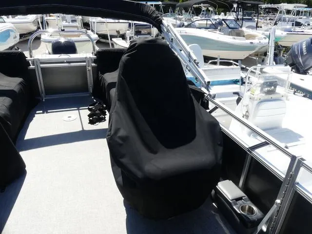 Slide: The Image of 2022 Avalon Catalina Platinum Quad Lounger 23 FT boat interior with covered seating. - 10
