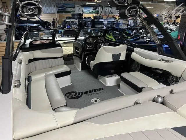 Slide: The Image of 2014 Malibu Wakesetter 22 MXZ interior with spacious seating and modern design. - 6