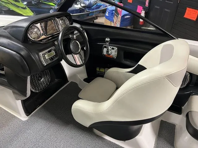 Slide: The Image of 2014 Malibu Wakesetter 22 MXZ interior with steering wheel and dashboard controls. - 9