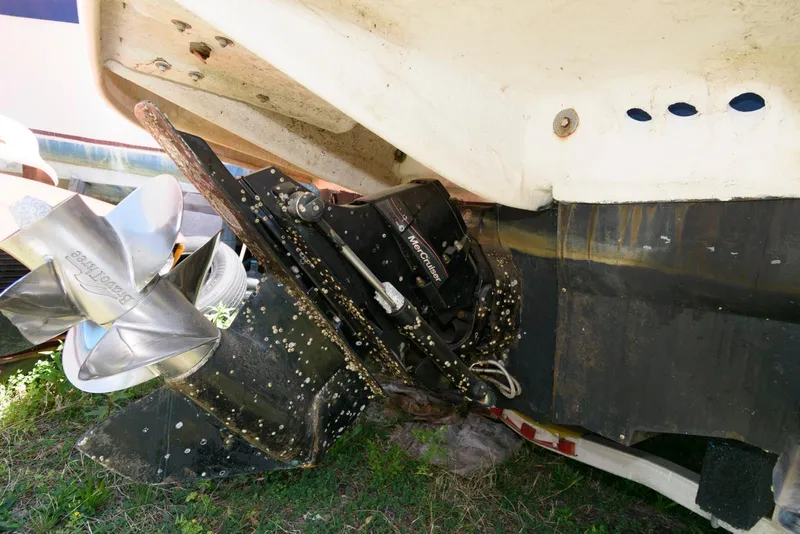 Slide: The Image of 2009 Sea Ray 240 Sundeck boat stern with propeller and outdrive detail. - 13