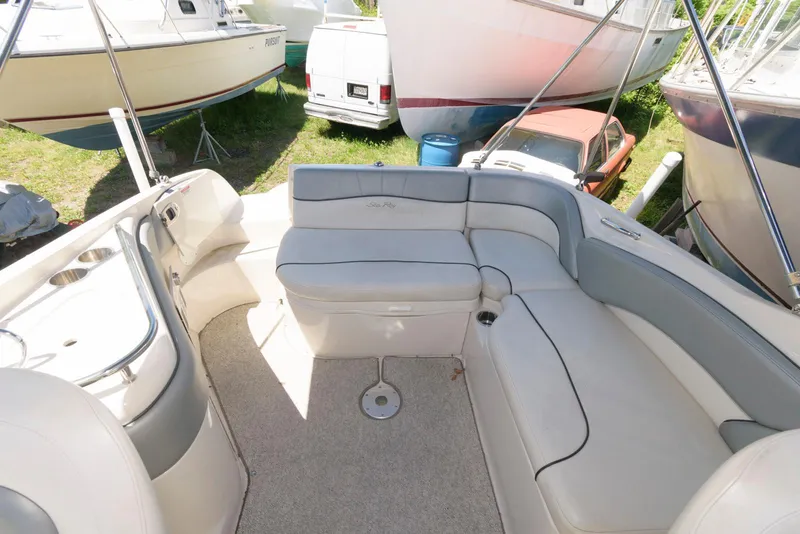 Slide: The Image of 2009 Sea Ray 240 Sundeck interior with spacious seating and elegant design. - 6